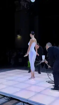 Designer Coperni is making a liquid fabric dress on Bella Hadid at Paris Fashion Week '23👠