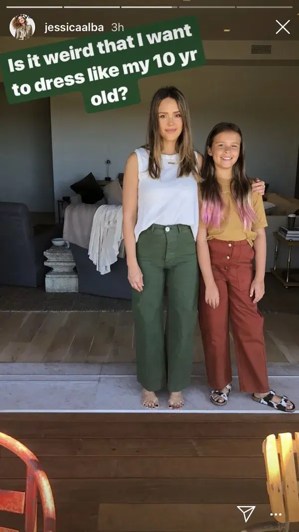 Green pants white top