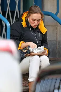 Lily Rose Depp clothes outfit street paparazzi 2020 earphones headphones eating junk food