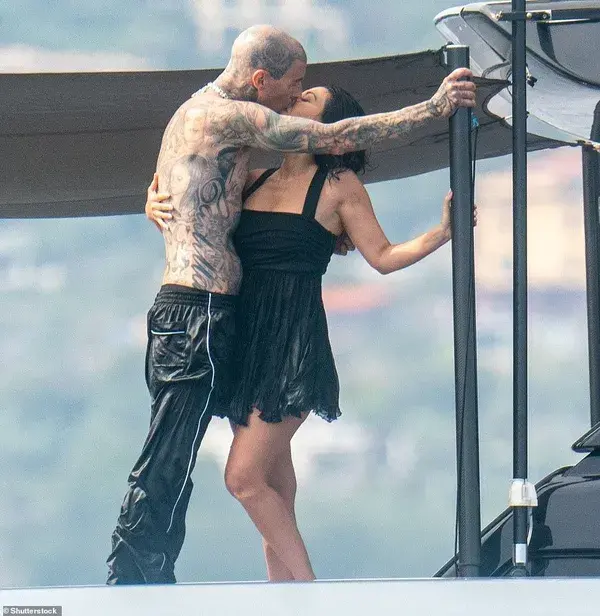 Still keeping up with the Kardashians! Energetic newlyweds Kourtney and Travis Barker  leap into the Mediterranean during post-wedding cruise on the Italian Riviera as they make their FIRST public appearance since marrying in Portofino