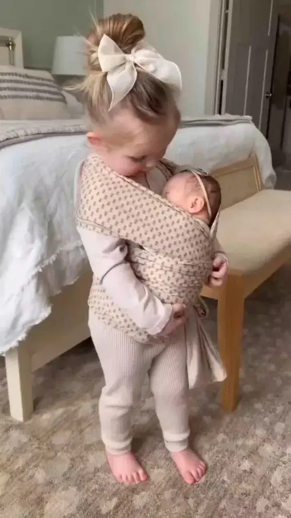Cute baby and sister