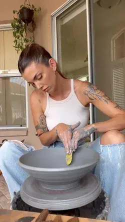 Making a large pottery dish