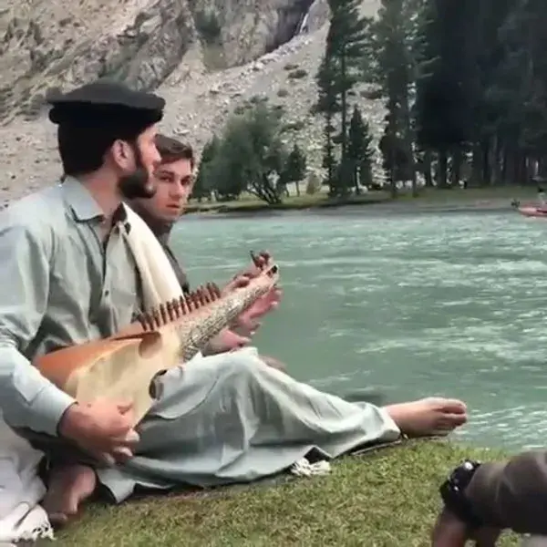 ‪a local playing Rubab at Mahodand lake, Swat valley, KPK, Pakistan ‬