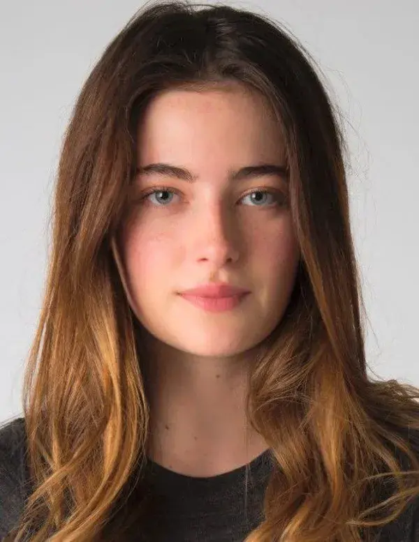 Millie Brady as America Singer