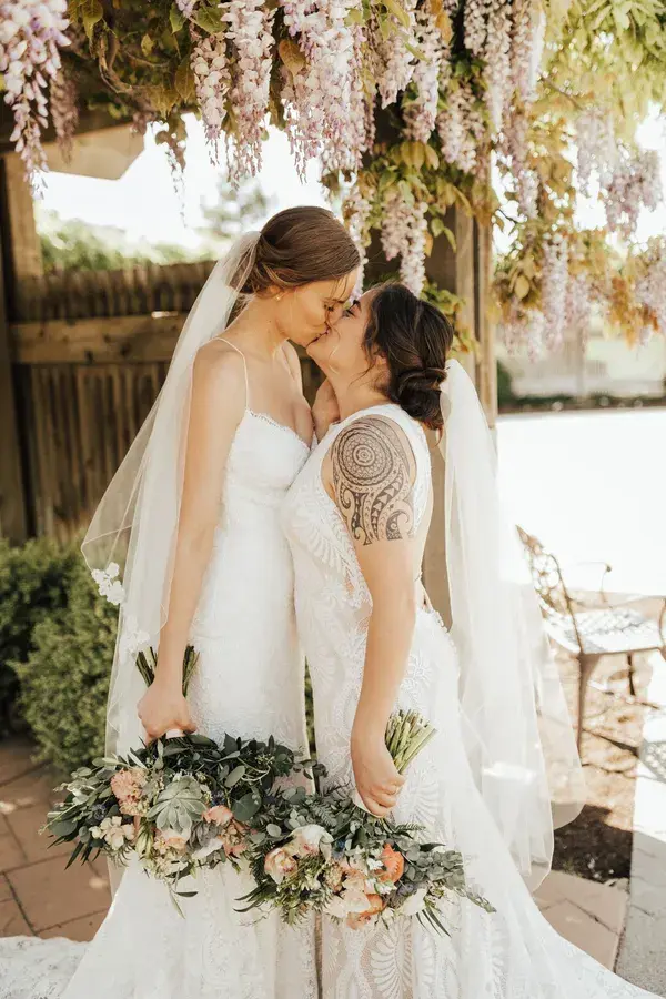 Mrs. and Mrs. -- Outdoor wedding, wedding dresses, bridal bouquets - Fantasy Bridal