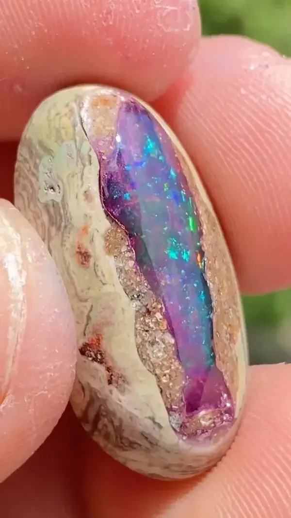 Loving the dancing colors in this purple opal