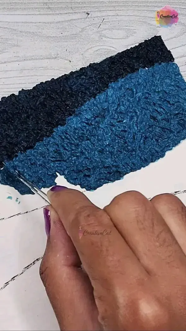 Textured painting with paper pulp