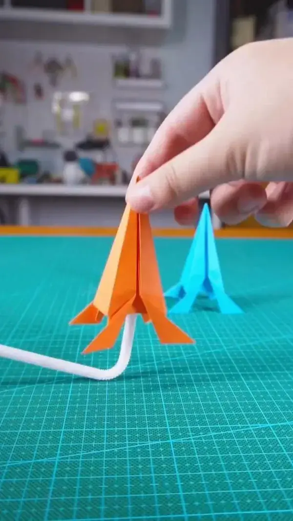 Fold a piece of paper to make a rocket that can fly to the sky!