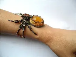 Items similar to Beaded Bracelet Amber Spider on Etsy | Beaded bracelets, Embroidery jewelry, Spider jewelry