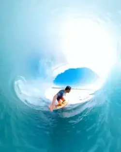 A clean wave and nice sky makes happy surfing